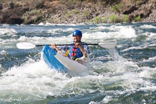 Kayaker heads downstream