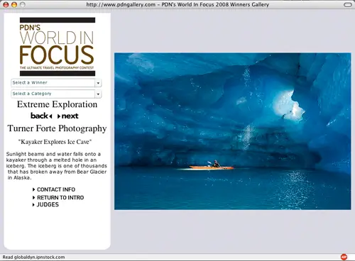 World In FOCUS Award for ODN in 2008. Photo of Kayaker in Ice Cave Bear Glacier, Alaska